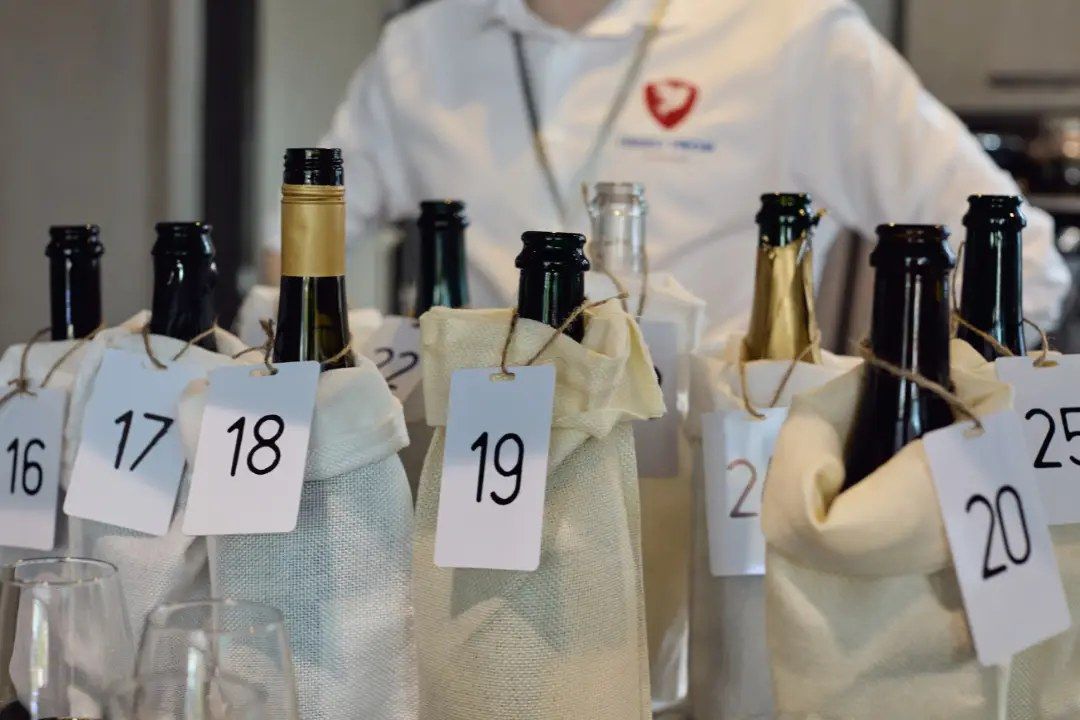 Numbered, bagged bottles at a blind tasting of The Independent Panel